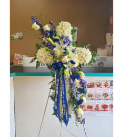 CROSS WHITE AND BLUE. An arrangement by Unique N Pretty Florist.