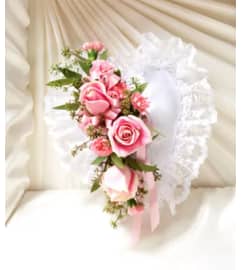 SATIN PILLOW WITH FLOWERS. An arrangement by Flowers by Priscilla.