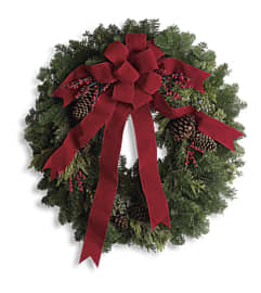Simple Tidings Wreath. An arrangement by L and J Blooms. Simple Tidings Wreath. An arrangement by L and J Blooms.