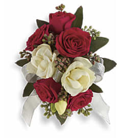 Wrist Corsage Roses. An arrangement by Sanger Flowers.