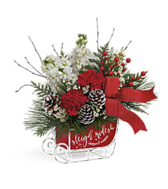Telefloras Santa's Vintage Sleigh Ride. An arrangement by Erika's Flowers.
