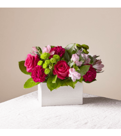 ATC Watermelon Punch. An arrangement by A Touch of Class Flowers and Drapery.