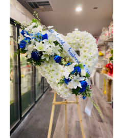 The Devotion Blue Heart. An arrangement by Geni's Florist and Gifts.
