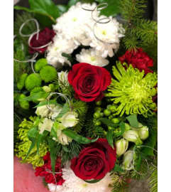 Cut Christmas Bouquet. A designers choice of cut wrapped flowers.. An arrangement by Flower Trends Florists.