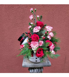 Cookie Jar Snowman Arrangement. An arrangement by Encore Florals, Wine and Gifts.