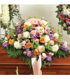 Casket Spray Pastel Color. An arrangement by Elegant Florist.