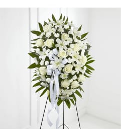 WHITE CLOUD STANDING SPRAY. An arrangement by Brasco Florist.