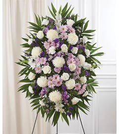 PURPLE LAVENDER WHITE COMPASSION SPRAY. An arrangement by Brasco Florist.