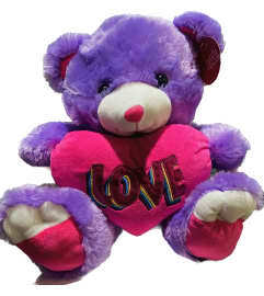 Purple Pink Plush Bear Musical. An arrangement by Geni's Florist and Gifts. Purple Pink Plush Bear Musical. An arrangement by Geni's Florist and Gifts.