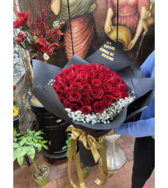 Red Buchones. An arrangement by Rose Flowers.
