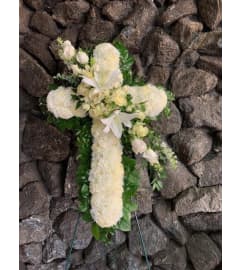 Cross In White. An arrangement by Flowers By Maria.