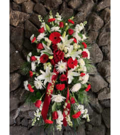 Standing Spray In Red And White. An arrangement by Flowers By Maria.