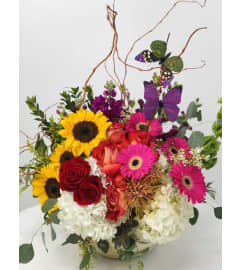 Butterflies and Sunshine. An arrangement by Blue Iris Florist.