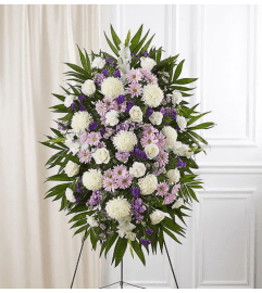 Lavender And White Funeral Standing Spray. An arrangement by Elegant Florist.