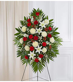 Elegant Red and White Sympathy Standing Spray. An arrangement by Elegant Florist.