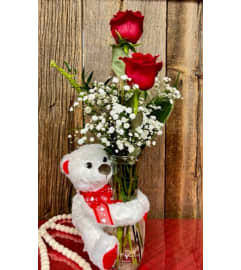 Valentine's Bear with Roses. An arrangement by Forest Florist. Valentine's Bear with Roses. An arrangement by Forest Florist.