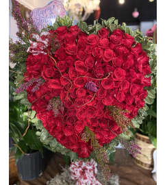 Red Rose Heart Specialty Piece Valentines Day # 2. An arrangement by Enchanted Flowers.