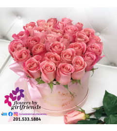 Dozen Roses or Two Dozen in a Hat Box Arrangement. An arrangement by Flowers by Girlfriends.