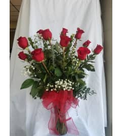 A Dozen Red Roses. An arrangement by M's Flowers.