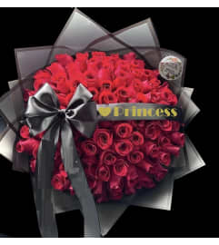 Red Roses Buschon Bouquet. An arrangement by Geni's Florist and Gifts.