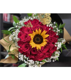 RAMO BUCHON 24. An arrangement by Blue Iris Florist.