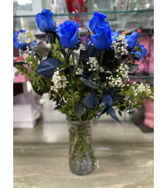 DOZEN BLUE ROSES VASED. An arrangement by Ditmars Flower Shop.