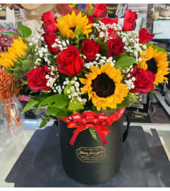 SunFlowers Lover Box. An arrangement by Geni's Florist and Gifts.
