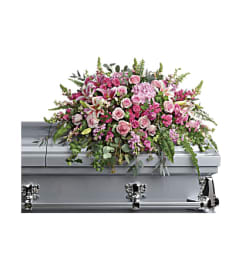 SOFT AND TENDER CASKET SPRAY. An arrangement by J.D. Ballantine's Flowers and Gifts.