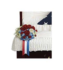 LOVING CASKET INSERT. An arrangement by J.D. Ballantine's Flowers and Gifts.