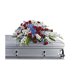 SACRED DUTY CASKET SPRAY. An arrangement by J.D. Ballantine's Flowers and Gifts.