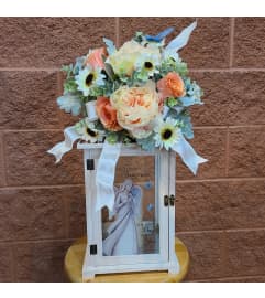 Tastefully Trimmed Exquisite Lantern. An arrangement by Busse and Rieck Flowers Plants and Gifts.