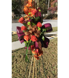 Seasons Change Standing Spray. An arrangement by Seasons Change Designs.