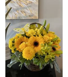 The Yellow Basket. An arrangement by Seasons Change Designs.