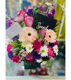 Birthday Smile Box. An arrangement by Geni's Florist and Gifts.