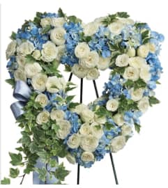 Wreath in Blue. An arrangement by Seasons Change Designs.