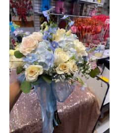 BRIDE BLUE WHITE BOUQUET. An arrangement by Geni's Florist and Gifts.