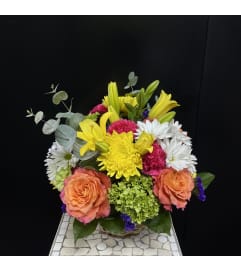 Marivel's Sunny Days. An arrangement by Marivel's Florist and Gifts.