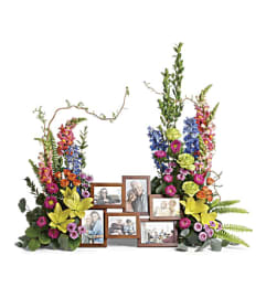 LOVING FAREWELL PHOTO TRIBUTE. An arrangement by J.D. Ballantine's Flowers and Gifts.