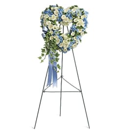 PUREST HEART STANDING SPRAY. An arrangement by J.D. Ballantine's Flowers and Gifts.
