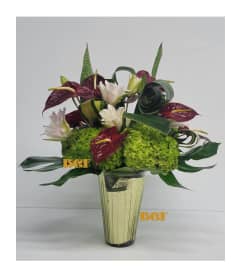 Topical Combination. An arrangement by Brickell Exclusive Blooms.