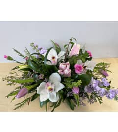 Purple Delight Centerpiece. An arrangement by Northwest Florist.