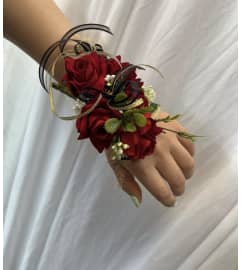 Red Corsage. An arrangement by Rose Flowers.