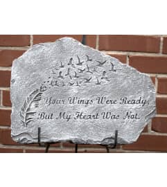 Your wings were ready Memorial Stone. An arrangement by North Liberty Flower Shop.