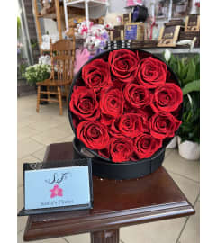 One Dozen Red Preserved Roses. An arrangement by Sonia's Florist.