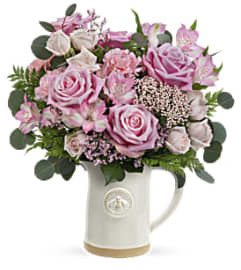 Mom's All abuzz. An arrangement by Palmetto Gardens Florist.