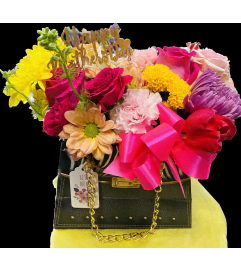 Purse Mixed. An arrangement by Geni's Florist and Gifts.