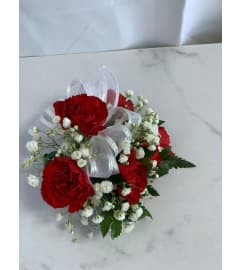 Red Mini Carnation Corsage - 48 HOURS NOTICE REQUIRED - PICKUP ON. An arrangement by Lori's Hearts and Flowers.