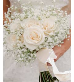 Bridal Bouquet white. An arrangement by Geni's Florist and Gifts.