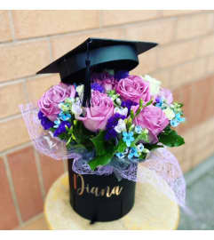 Graduation Hat Arrangement (PRE-ORDER ONLY). An arrangement by Petals.