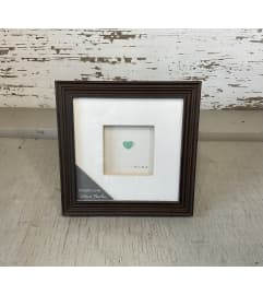Sharon Nowlan “Simple Love” Frame. An arrangement by Metcalfe Florist and Pleasant View Greenhouses.